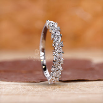 Handmade jewelry featuring pear and round cut diamonds.