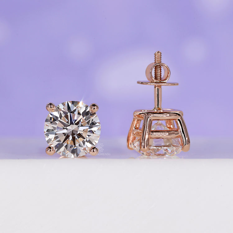 Stud women earrings with 4 carat diamond stones in an elegant setting.