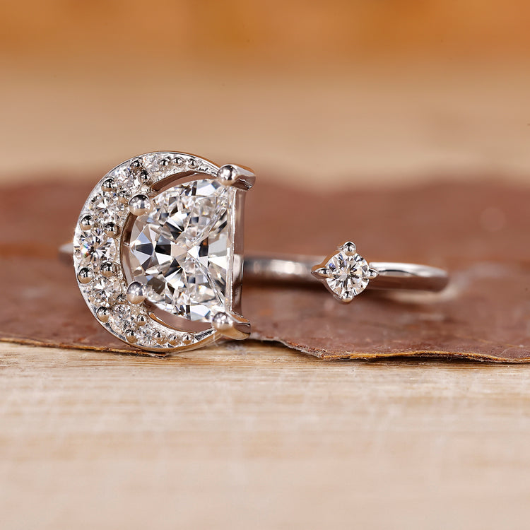 Half moon diamond ring with a custom diamond setting.