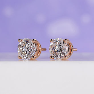 Diamond stud earrings for women with a modern rose gold finish.