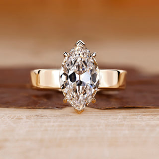 Old European cut diamond ring in yellow gold solitaire setting.