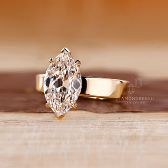 Four claw prong ring featuring Old European cut diamond and custom design.