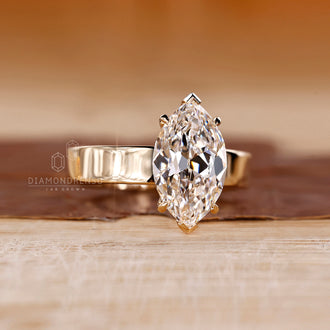 Yellow gold diamond ring with Old European cut solitaire setting.