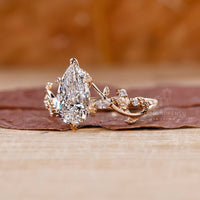 Marquise and round side stone ring with balanced brilliance.