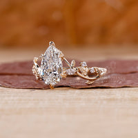 Marquise and round side stone ring with balanced brilliance.