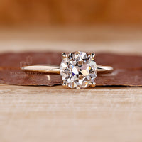 Yellow gold solitaire diamond engagement ring.