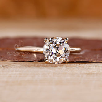 Yellow gold solitaire diamond engagement ring.