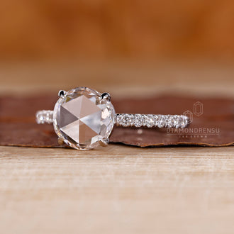 White gold diamond ring with rose cut diamond and four claw prong.