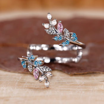 Nature inspired wedding band in white gold with pink sapphire.