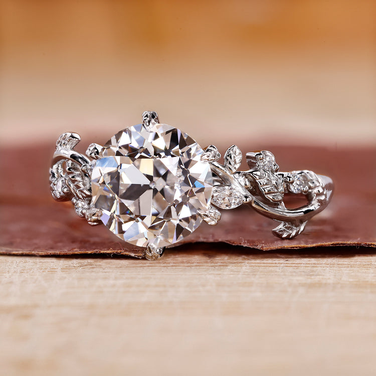 Nature inspired engagement ring with delicate floral details.