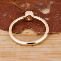 Handmade jewelry arranged beside a diamondrensu ring box.