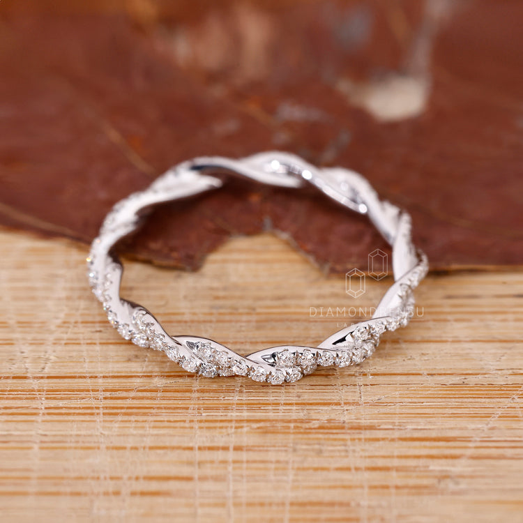 Diamondrensu wedding band in white gold with round diamonds set in a full eternity design.