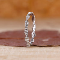 Twisted Wedding Band with round diamonds set in a white gold full eternity design.