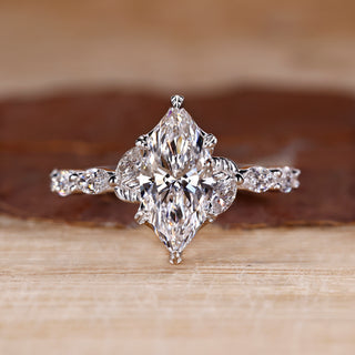 Marquise cut diamond ring in white gold with nature inspired design.