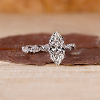 White gold diamond ring reflecting light with a modern, elegant profile.