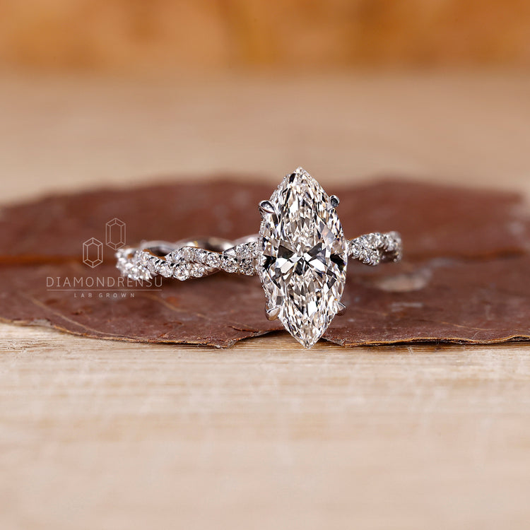 White gold diamond ring reflecting light with a modern, elegant profile.