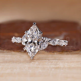 Pave setting ring with marquise cut diamonds in white gold.