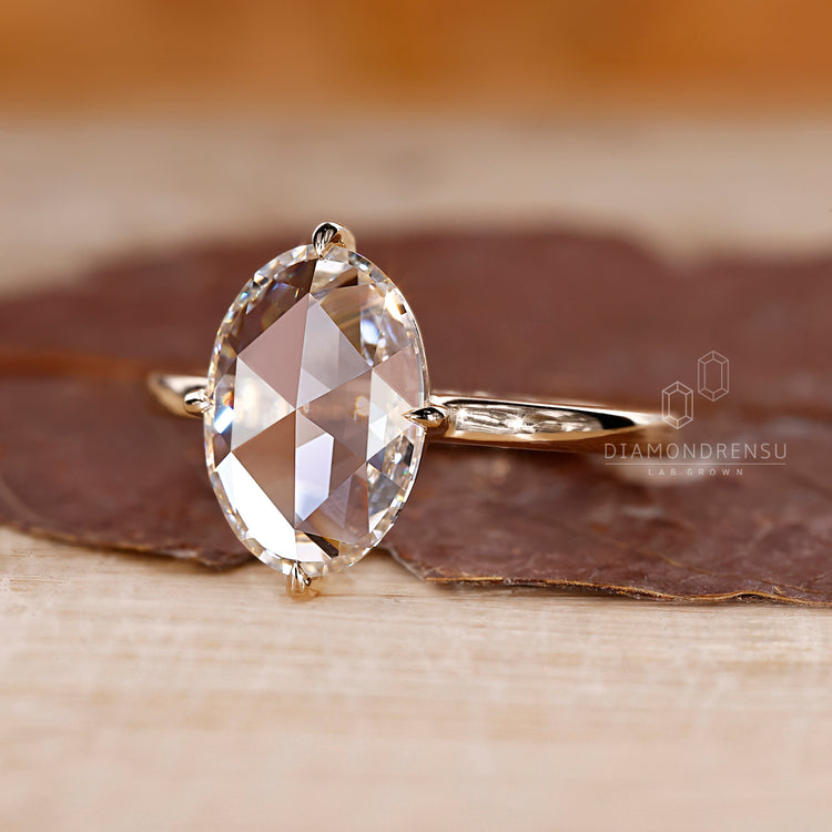 Yellow gold engagement ring with a classic 4 prong claw setting.