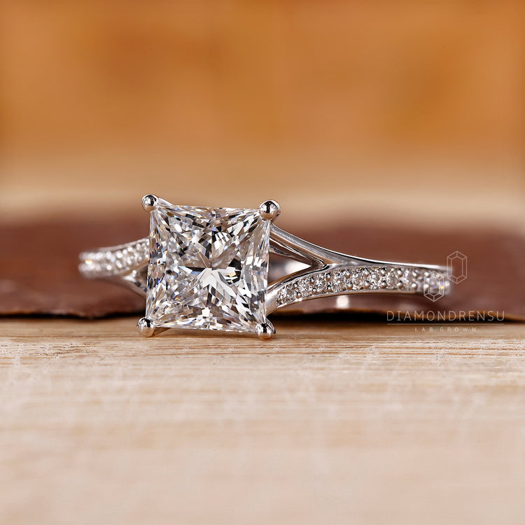 Cathedral ring setting with princess cut diamond.