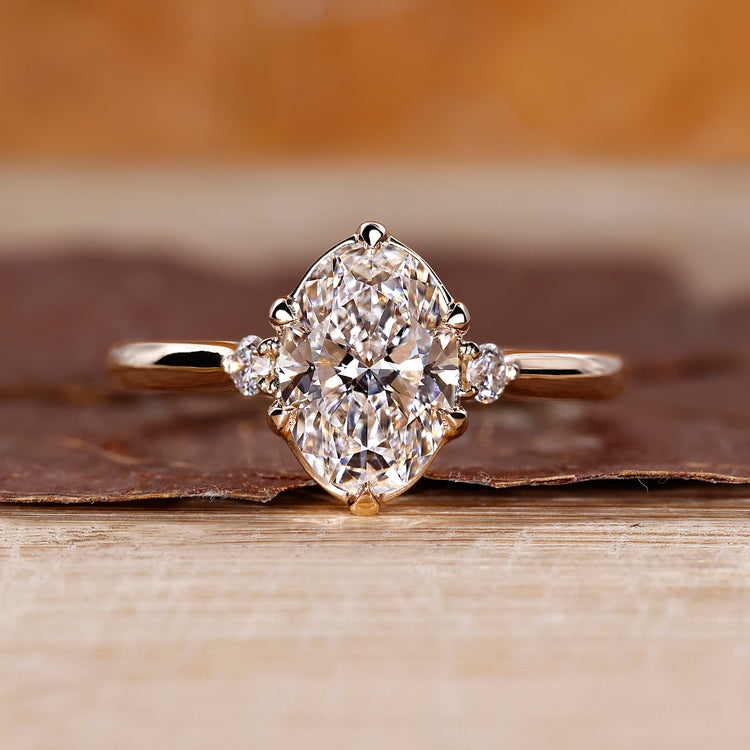 Oval cut engagement ring with 3 stone design.