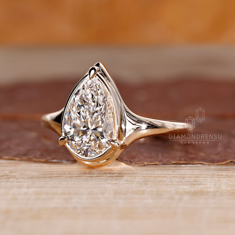 Bezel Setting engagement ring with lab grown diamond.