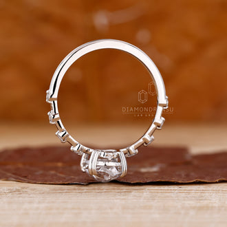 Buy engagement ring with oval rose cut diamond and distance pave setting.