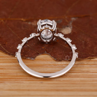 Custom diamond ring with oval rose cut diamond and hidden stone design.