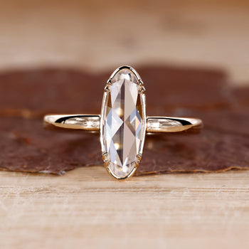 Yellow gold engagement ring with moval rose cut ring.