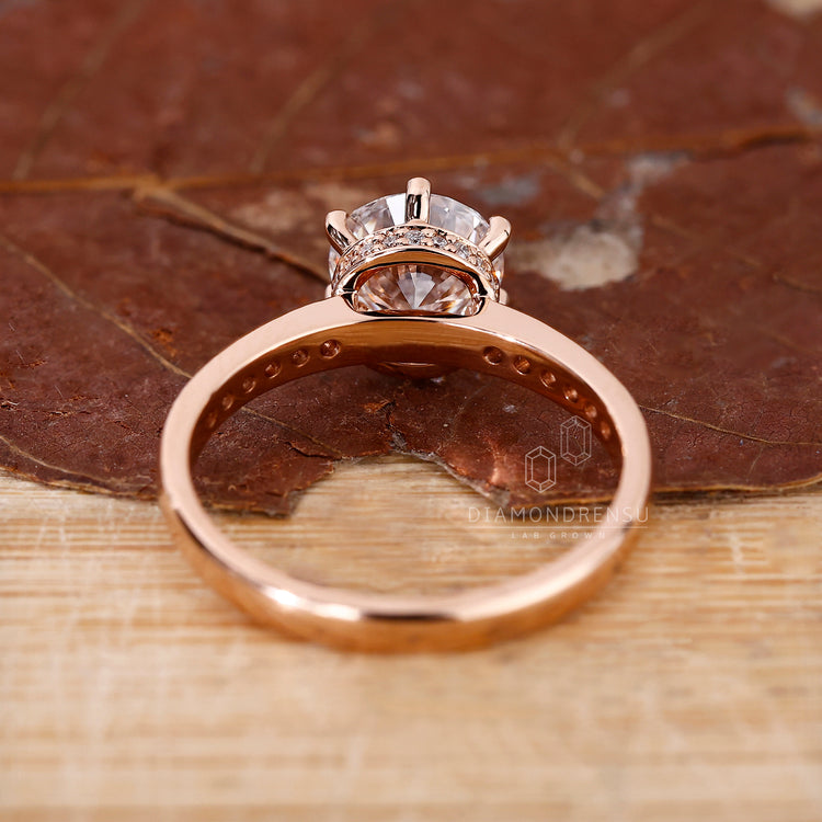 A pave round cut diamond band in warm rose gold