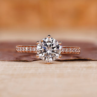 A rose gold round engagement ring with a classic look