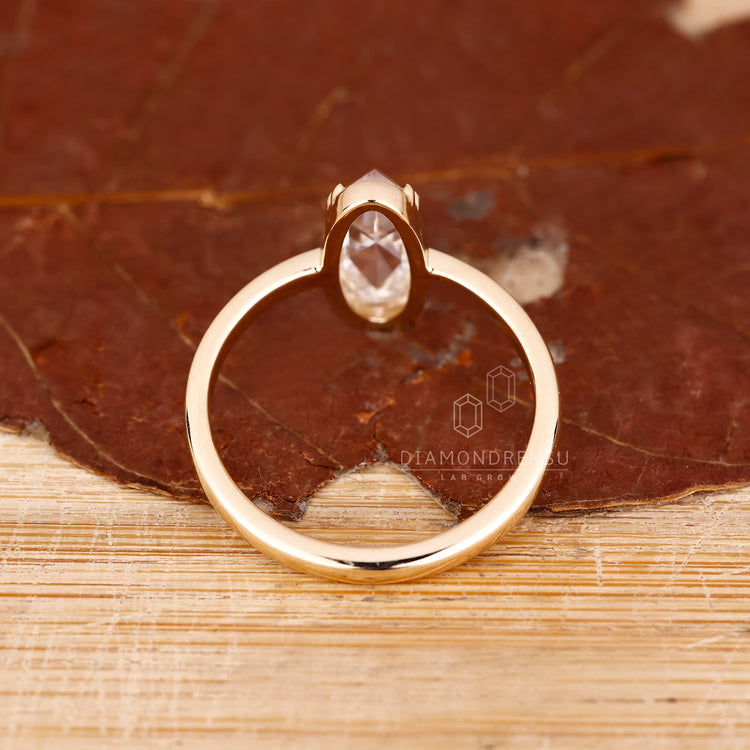 Moval rose cut ring with double prong setting.