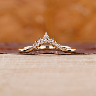 A 7 stone wedding band sparkling with brilliance on a bride's hand.