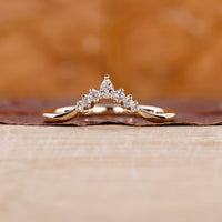 A 7 stone wedding band sparkling with brilliance on a bride's hand.