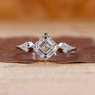 Asscher cut diamond ring with a sleek design.