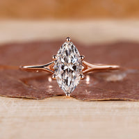 Marquise diamond ring with a split shank design.