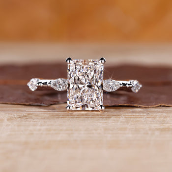 Radiant cut diamond ring with hidden halo in white gold setting.