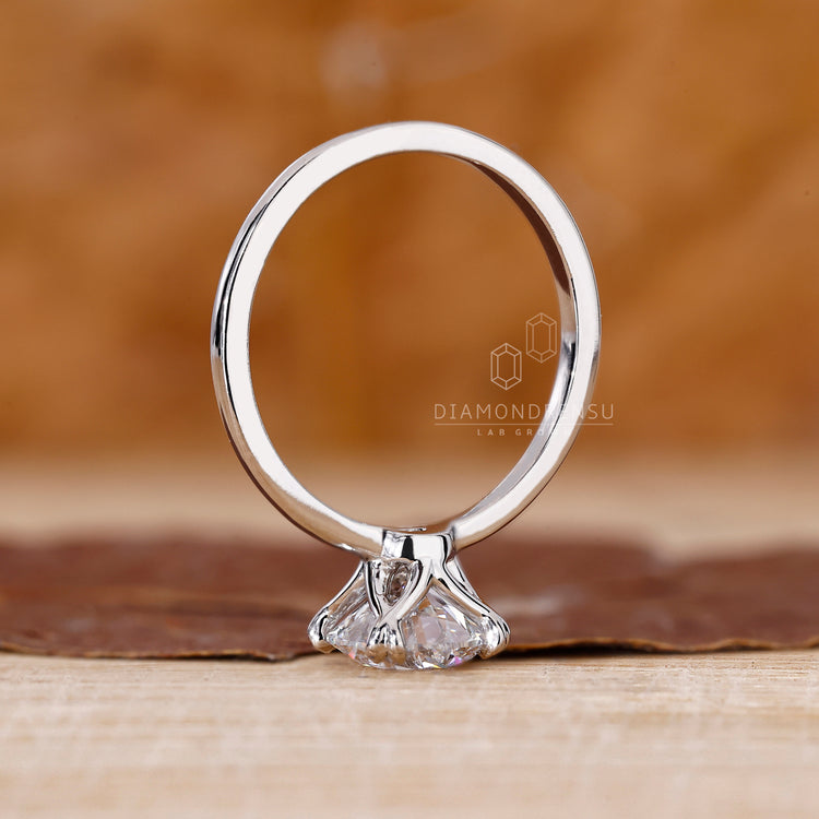 Buy engagement ring featuring a handmade round diamond solitaire.
