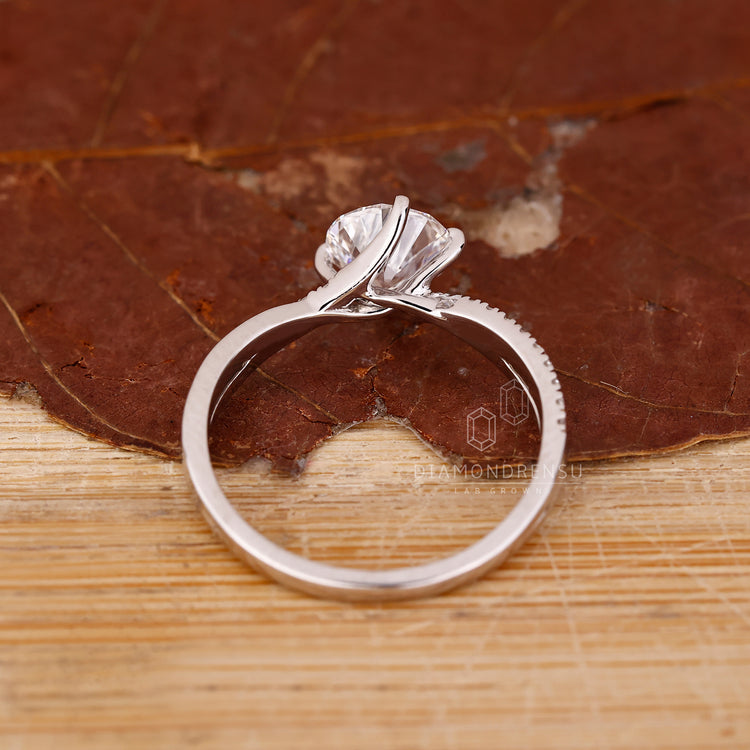 Handmade ring crafted with twisted pave design in white gold.