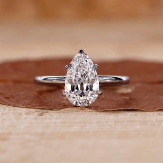 Pear shaped diamond solitaire ring in white gold.