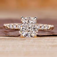 Cushion cut hidden halo engagement ring with lab grown center diamond.