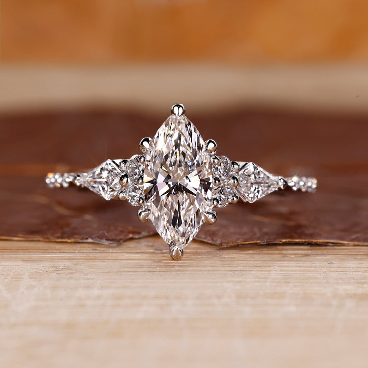 Marquise shaped diamond ring with white gold band.