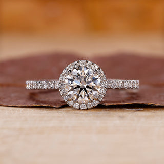 White gold ring with round cut engagement diamond.