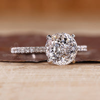 Handmade Portuguese cut ring with cathedral setting and pave band.