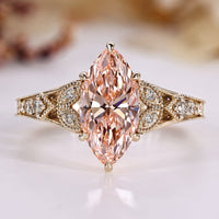 Art Deco diamond ring with marquise and pink details.