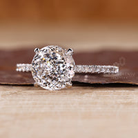 Portuguese cut engagement ring with round cut pave band.