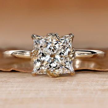 Princess cut diamond ring with solitaire style setting.