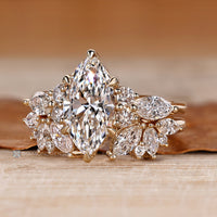 Nature inspired marquise ring with round side stones.