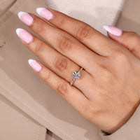 Vintage Diamond Ring with four leaf prong and hidden stone accents.