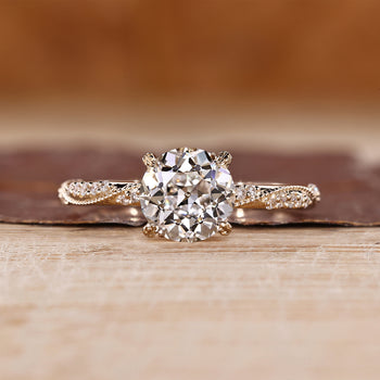 Vintage Diamond Ring with round old European cut and hidden marquise and round stones.