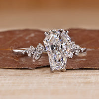 IGI certified coffin cut diamond ring with four claw prong setting.